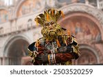  beautiful carnival costume in front of the splendid Basilica of San Marco in Venice