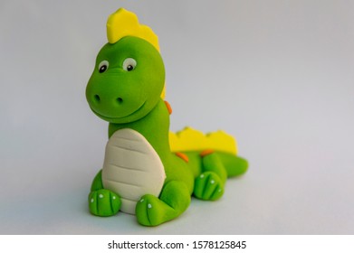 Beautiful Cartoon Like Green Fondant Dragon Figure, Isolated On White Background