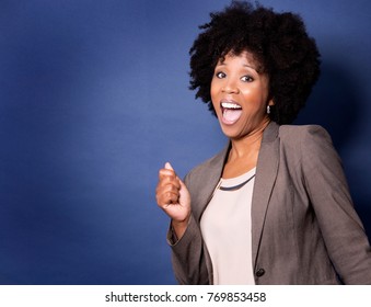 Beautiful Casual Black Woman Wearing Jacket And Jeans On Dark Blue Background