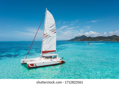 Beautiful catamaran in the paradise turquoise lagoon of the east coast of Mauritius
