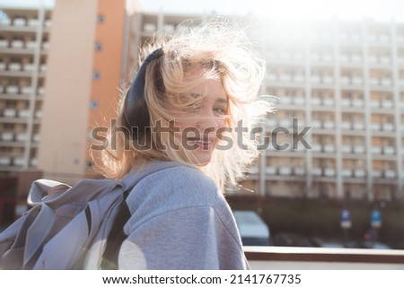 Similar – Young blonde woman in a sunny day in the city