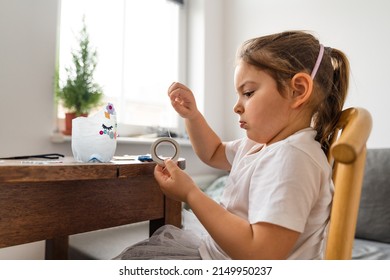 Beautiful Caucasian Preschool Girl Playing At Home And Doing Crafts From Plastic Bottle. Recycle Toys And Diy Creativity 