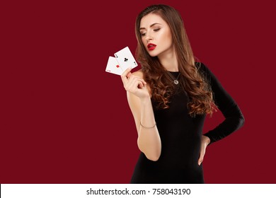 Beautiful Caucasian Woman In Black Dress With Poker Cards Gambling In Casino