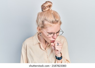 Beautiful Caucasian Woman With Blond Hair Wearing Casual Look And Glasses Feeling Unwell And Coughing As Symptom For Cold Or Bronchitis. Health Care Concept. 