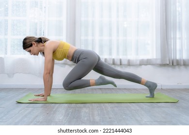 Beautiful Caucasian Woman Doing Plank Exercise Training In The Living Room At Home.