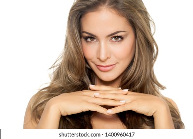 Beautiful Caucasian Woman With Long Groomed Hair Posing On White Background.