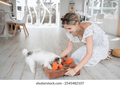 Beautiful caucasian woman playing with Yorkshire Terrier dog	 - Powered by Shutterstock