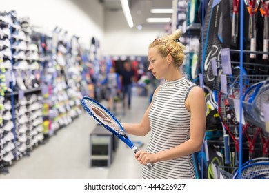 Beautiful Caucasian Woman Shopping Sports Equipment In Sportswear Store.