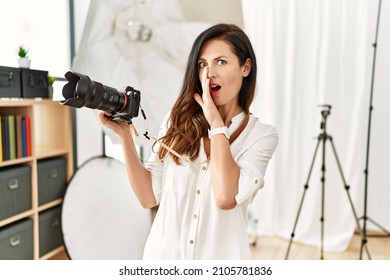 Beautiful Caucasian Woman Working As Photographer At Photography Studio Hand On Mouth Telling Secret Rumor, Whispering Malicious Talk Conversation 