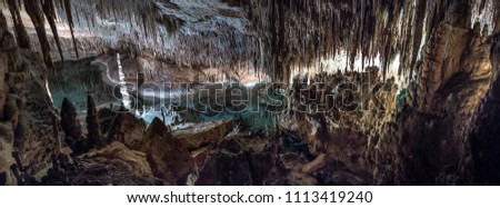 Beautiful cave interior with ancient stalactites and stalagmites