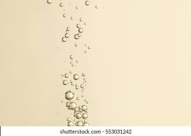 Beautiful Champagne Bubbles Over A Blurred Background