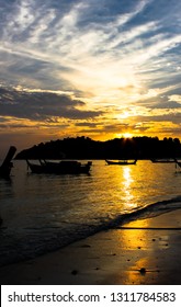 Beautiful charming sunset by the sae on the beach of lipe island, mountains and twilight sky