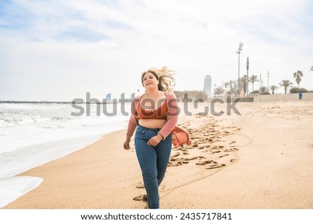 Beautiful and cheerful plus size young woman outdoors - Pretty overweight curvy female, concepts about femininity, women power, female emancipation, body positivity and body acceptance