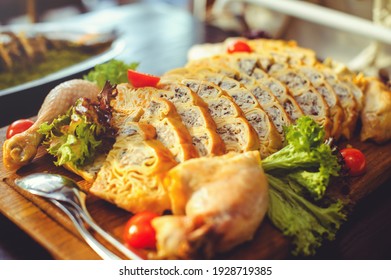 Beautiful Chicken And Mushroom Pie With Herbs, Tomatoes And Chicken Legs On A Wooden Board In A Restaurant. Selective Focus, Close-up.