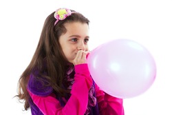 Beautiful Child Blowing A Balloon