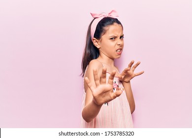 Beautiful Child Girl Wearing Casual Clothes Disgusted Expression, Displeased And Fearful Doing Disgust Face Because Aversion Reaction. With Hands Raised 