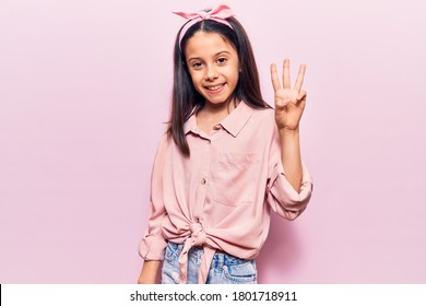 Beautiful Child Girl Wearing Casual Clothes Showing And Pointing Up With Fingers Number Three While Smiling Confident And Happy. 