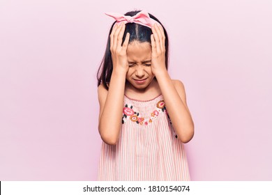 Beautiful Child Girl Wearing Casual Clothes Suffering From Headache Desperate And Stressed Because Pain And Migraine. Hands On Head. 