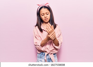 Beautiful Child Girl Wearing Casual Clothes Suffering Pain On Hands And Fingers, Arthritis Inflammation 