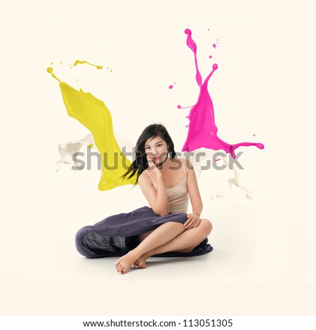 Beautiful chinese girl with paint wings sitting on the floor. Isolated. /Color Wings