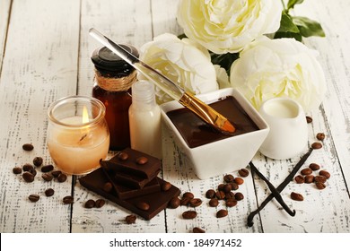 Beautiful chocolate spa setting on wooden table close-up - Powered by Shutterstock