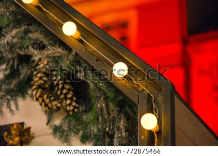 Beautiful Christmas Decorations Hanging On Roof Outside The House Green Needles Pine Cones Beautiful Christmas Decorations Hanging On Roof Outside The House Green Needles Pine Cones