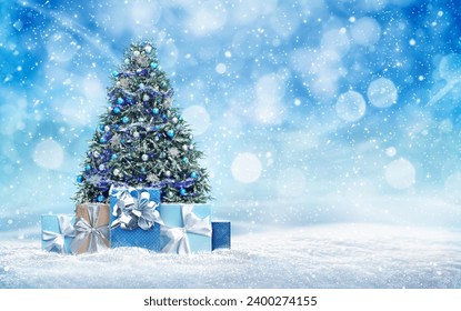 Beautiful Christmas tree with gift boxes on snow against blurred background. Space for text - Powered by Shutterstock