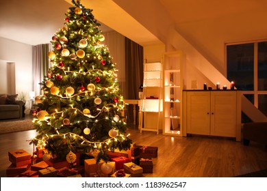 Beautiful Christmas tree with gifts in living room - Powered by Shutterstock