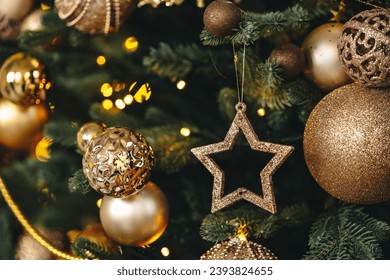 Beautiful Christmas tree with golden balls decor close up - Powered by Shutterstock