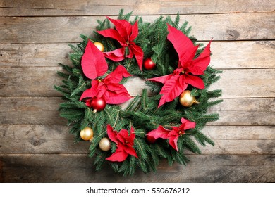 Beautiful Christmas wreath on wooden background - Powered by Shutterstock