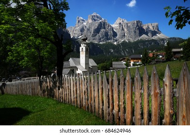 Beautiful Church of Colfosco in Alta Badia Dolomites with Sella Group on the background. Trentino Alto Adige, Italy.