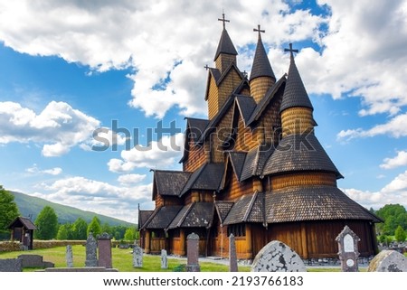 The beautiful church in Norway in Heddal. The Stave Church is crowned with crosses. Travel to Norway in summer. 