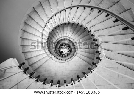 Beautiful circular staircase in old house, snail geometry, black and white