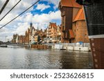 Beautiful city of Gdansk in the margins of the Motlawa river with the touristic boats and coloured buildings