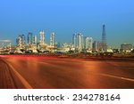 beautiful city scape of road and land transportation against lighting of oil refinery industry plant  use as energy and fuel power topic background