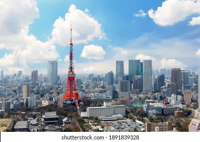 
Beautiful city skyline of Downtown Tokyo, with the famous landmark Tokyo Tower standing out amid the crowded skyscrapers under blue sunny sky and Zoujouji temple located in the nearby Shiba Koen Park