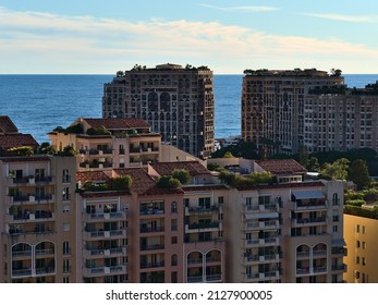 Beautiful cityscape of Monaco at the French Riviera with mediterranean sea and luxury residential high-rise buildings of district Fontvieille in the afternoon sunlight.