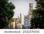 A beautiful cityscape taken from the Vlamingstraat in Brugge (Bruges) in Flanders, Belgium with a view of the tower of the Historium and the Belfry in the skyline