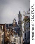 A beautiful cityscape taken from the Vlamingstraat in Brugge (Bruges) in Flanders, Belgium with a view of the tower of the Historium in the skyline