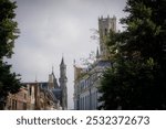 A beautiful cityscape taken from the Vlamingstraat in Brugge (Bruges) in Flanders, Belgium with a view of the tower of the Historium in the skyline