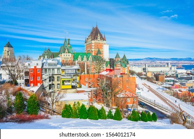 Beautiful Cityscape View Of Old Quebec City With Iconic Chateau Frontenac, Dufferin Terrace And St. Lawrence River In Winter Sunny Day, National Historic Site Of Canada, Most Famous Landmark Of Quebec