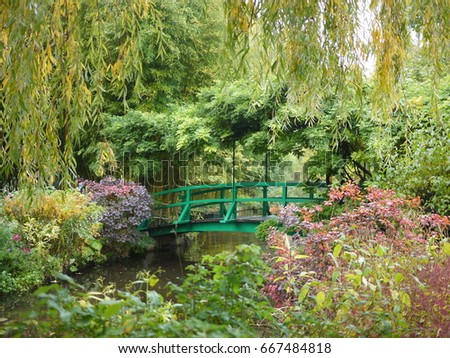 Beautiful Claude Monet's Garden of Giverny, Normandy, France in auturmn with the iconic green Japanese bridge 