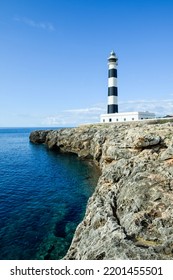 Beautiful Clear Ocean Water With Striking Coastal Feature Of A Lighthouse On The Cliff