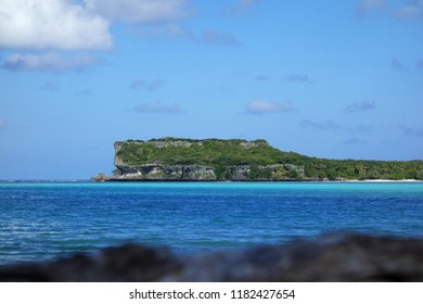 Beautiful Cliff In Front Of Lekiny's Bay Blue Water With Foreground. Ouvéa, New Caledonia.