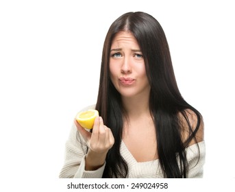 Beautiful close-up portrait of young woman with lemons. Sour taste.