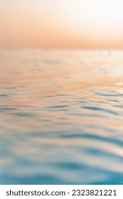 Beautiful closeup sea water surface. Sunset sunrise gold blue colors calm soft waves relaxing horizon. Dream fantasy shallow focus, blur seascape sky. Tranquil peaceful nature pattern, Mediterranean - Shutterstock ID 2323821221