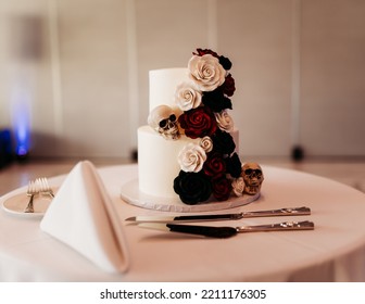 A Beautiful Closeup Shot Of A Wedding Cake With Halloween Themed Decoration