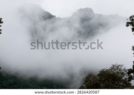 Beautiful cloud formations preceding the rain, covering Doi Luang Chiang Dao mountain in Chiang Dao district, Chiang Mai province