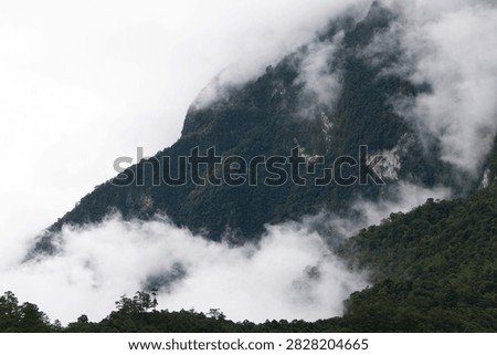 Beautiful cloud formations preceding the rain, covering Doi Luang Chiang Dao mountain in Chiang Dao district, Chiang Mai province
