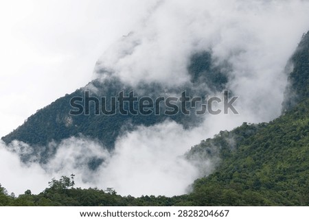 Beautiful cloud formations preceding the rain, covering Doi Luang Chiang Dao mountain in Chiang Dao district, Chiang Mai province
